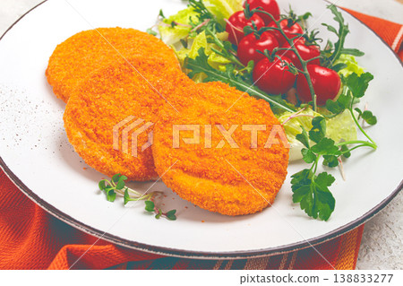 crispy fried fish cutlets, fish burgers, on a white plate, with fresh lettuce leaves, arugula and cherry tomatoes, homemade, no people, crispy fried fish cutlets, fish burgers, on a white plate, with fresh lettuce leaves, arugula and cherry tomatoes, homemade, no people, 138833277