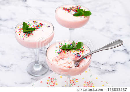 fruit mousse, made from jelly and cottage cheese, in glasses, decorated with sprinkles and mint, homemade fruit mousse, made from jelly and cottage cheese, in glasses, decorated with sprinkles and mint, homemade 138833287