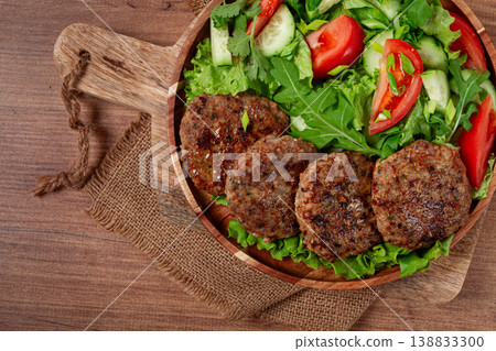 Fried cutlets, mixed minced meat, with vegetable salad, homemade, top view, no people, Fried cutlets, mixed minced meat, with vegetable salad, homemade, top view, no people, 138833300