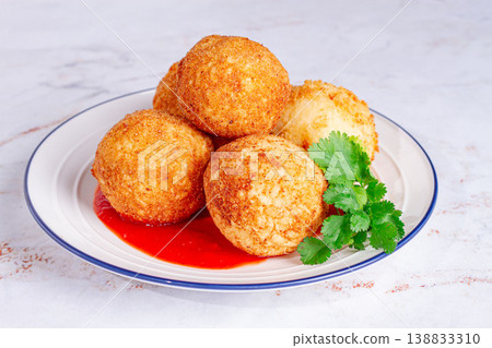 arancini appetizer with tomato sauce, on a white plate, homemade, no people, 138833310