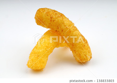 Puffed corn peanuts snacks isolated on white background. Puffed corn peanuts snacks isolated on white background. 138833803