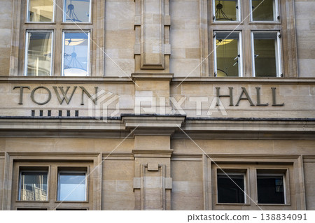 Town hall sign on stone facade in town centre 138834091