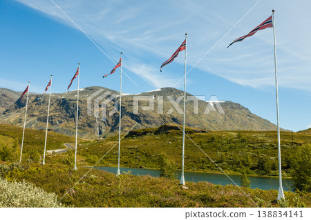 Norwegian flags and mountains landscape Norwegian flags and mountains landscape 138834141