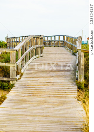 Wooden path to beach sea water. Wooden path to beach sea water. 138834187
