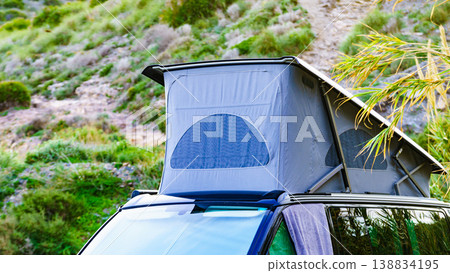 Camper van with roof top tent camp on nature Camper van with roof top tent camp on nature 138834195