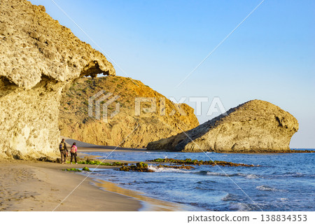 People walk on Monsul beach, Park Cabo de Gata, Spain People walk on Monsul beach, Park Cabo de Gata, Spain 138834353