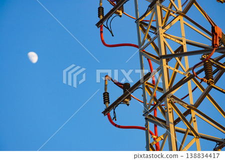 High voltage towers against blue sky High voltage towers against blue sky 138834417