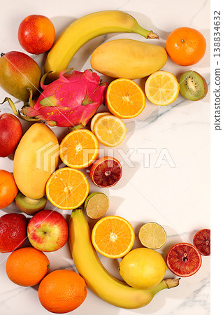 Healthy vegan products for healthy lifestyle. Apples, oranges, lemons, tangerines, bananas and natural juice on concrete background, detox diet and weight loss concept, store advertisement. 138834632