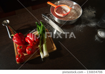 Kitchen table with fresh vegetables and flour for homemade cooking. Top view 138834706