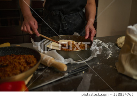 Preparing lasagna dough and filling in home kitchen Preparing lasagna dough and filling in home kitchen 138834765