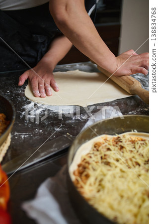Kitchen scene with ingredients and tools for homemade lasagna preparation 138834768