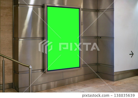 Advertising board display green mockup on steel wall tiles at underground passage Advertising board display green mockup on steel wall tiles at underground passage 138835639