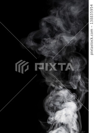Smoke flowing against a black background Smoke flowing against a black background 138835954