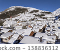 Flight over the famous village of Andermatt in Switzerland in winter - aerial photography 138836312