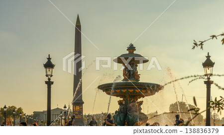 Place de la Concorde in Paris, Luxor Obelisk and Fontaine des Mers spouting water, with the warm glow of sunset Place de la Concorde in Paris, Luxor Obelisk and Fontaine des Mers spouting water, with the warm glow of sunset 138836379