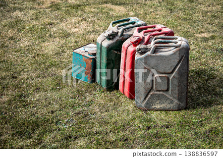 Oil Crisis Concept with Old Fuel Cans Representing Energy Shortage and Supply Issues Oil Crisis Concept with Old Fuel Cans Representing Energy Shortage and Supply Issues 138836597
