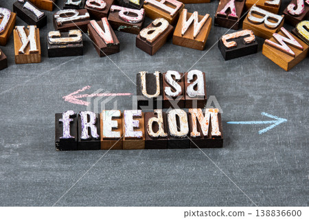 USA Freedom Concept With Opposing Arrows and Wooden Letter Blocks USA Freedom Concept With Opposing Arrows and Wooden Letter Blocks 138836600