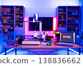 A 3D printer is set up on a desk with spools of filament and a laptop displaying the word HOME, illuminated by colorful LED lights 138836662