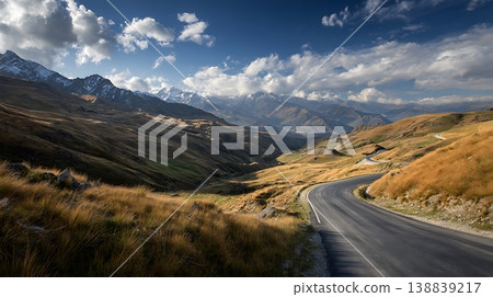Scenic Mountain Road with Cloudy Blue Sky 138839217