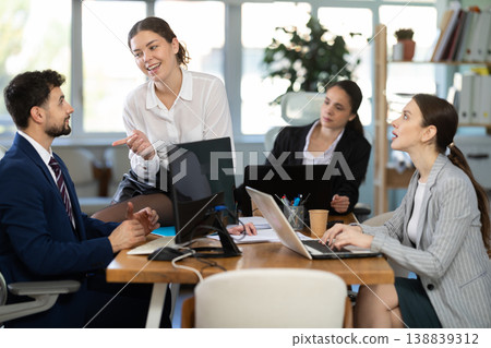 female employee of the company flirts with a male employee female employee of the company flirts with a male employee 138839312