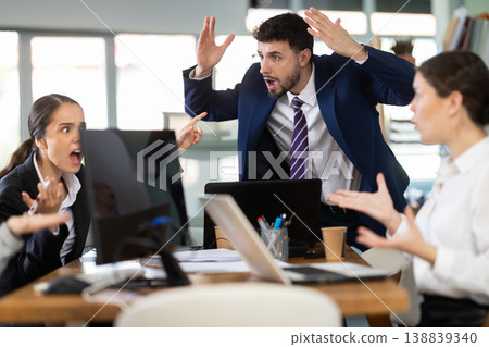 Group of men and women arguing loudly in office Group of men and women arguing loudly in office 138839340