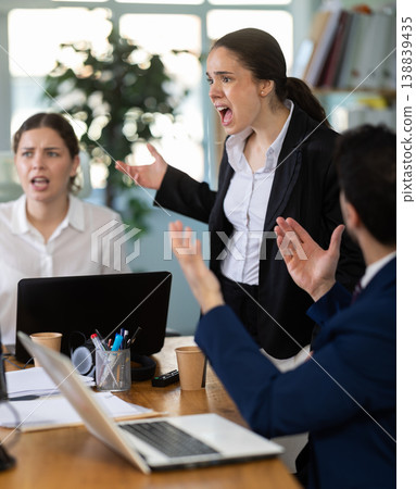 Group of men and women arguing loudly in office Group of men and women arguing loudly in office 138839435