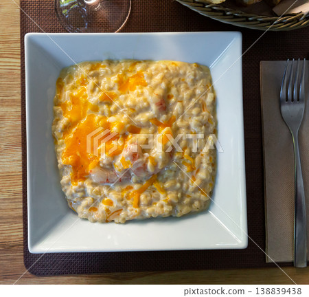 Tasty Risotto with seafood and Gratin Tasty Risotto with seafood and Gratin 138839438