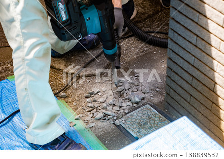 A construction site where concrete is being chipped away for pipe installation work. A construction site where concrete is being chipped away for pipe installation work. 138839532