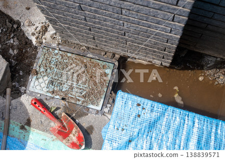 Water leaks discovered during excavation work around a house. Water leaks discovered during excavation work around a house. 138839571