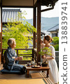 Seniors chatting with their grandchildren on the veranda 138839741