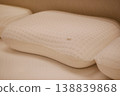 orthopedic pillows arranged on a bed during the day 138839868