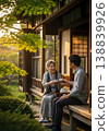 Seniors chatting with their grandchildren on the veranda 138839926