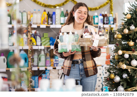 On New Year Eve, woman choose and buy cosmetics gift set On New Year Eve, woman choose and buy cosmetics gift set 138842079