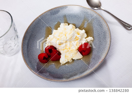 Catalan dessert - fresh cheese Mato with honey and strawberry 138842280
