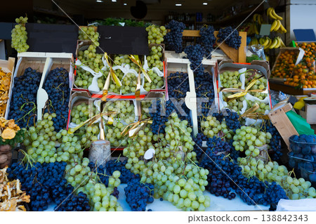 Image of autumn goods- grapes and chanterelles on the counter 138842343