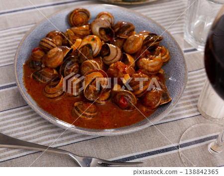 Dish of snails prepared at spanish style Dish of snails prepared at spanish style 138842365
