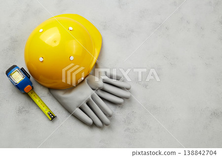 Happy labor day concept. Construction tools, yellow helmet on dark wooden background 138842704