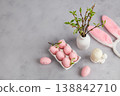 Easter holiday with pastel pink eggs, vase with branches and bunny ears on grey background 138842710