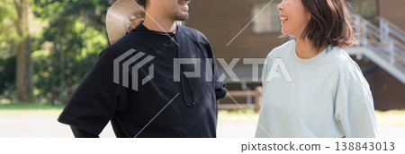 A smiling couple gazing at each other, evoking images of vacation homes, camping, outdoor activities, and rural relocation. (Banner without faces) A smiling couple gazing at each other, evoking images of vacation homes, camping, outdoor activities, and rural relocation. (Banner without faces) 138843013