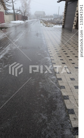 Quiet urban morning with wet surfaces and distant construction Quiet urban morning with wet surfaces and distant construction 138843341