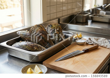 Pen Shells in Kitchen Prep Area with Knife and Ingredients 138843589