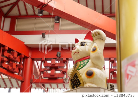 The Maneki-neko (beckoning cat), a symbol of Osu Shopping Street. 138843753