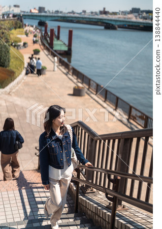 A woman sightseeing in Asakusa - Springtime Tokyo sightseeing portrait 138844440