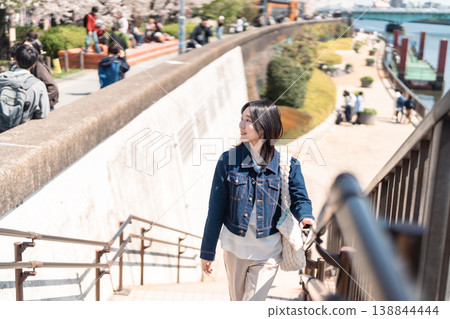 A woman sightseeing in Asakusa - Springtime Tokyo sightseeing portrait A woman sightseeing in Asakusa - Springtime Tokyo sightseeing portrait 138844444