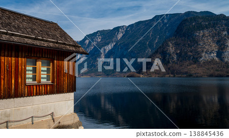 Scenic lake near Hallstatt, a peaceful escape with crystal-clear waters and majestic mountain views. 138845436