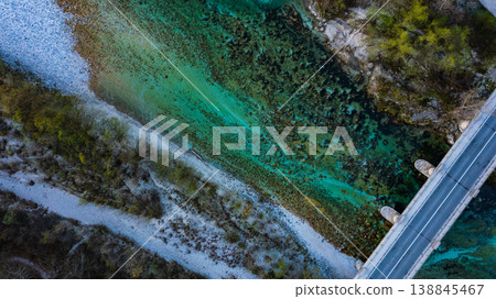 Aerial view of Soca river with its distinctive emerald green colour, nestled between the Julian Alps in western Slovenia. Aerial view of Soca river with its distinctive emerald green colour, nestled between the Julian Alps in western Slovenia. 138845467