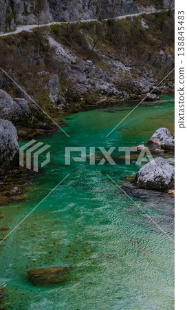 Beautiful turquoise mountain river. Soca (Isonzo) river, Julian Alps of Slovenia. Popular touristic destination. 138845483