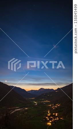 Vertical shot Sunset over alpine valley with village and mountains in Slovenia Vertical shot Sunset over alpine valley with village and mountains in Slovenia 138845499