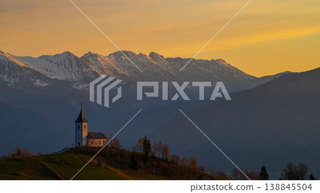 Sunrise at Jamnik Church in Slovenia with pastel sky and alpine landscape Sunrise at Jamnik Church in Slovenia with pastel sky and alpine landscape 138845504