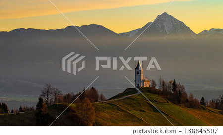Sunrise at Jamnik Church in Slovenia with pastel sky and alpine landscape Sunrise at Jamnik Church in Slovenia with pastel sky and alpine landscape 138845507